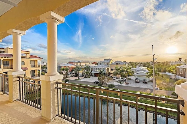 balcony at dusk with a water view