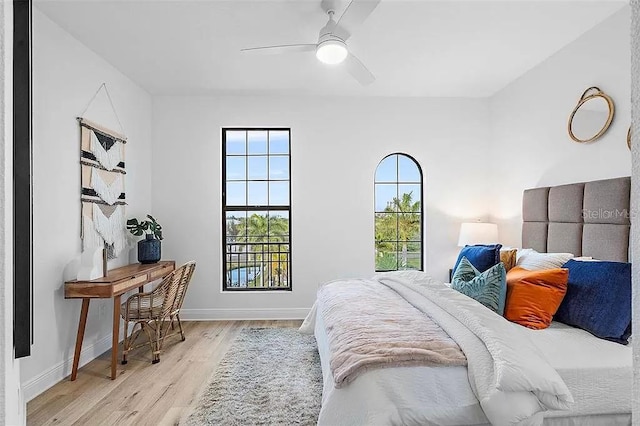 bedroom featuring ceiling fan and light hardwood / wood-style flooring