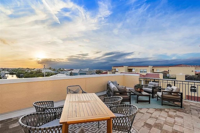 patio terrace at dusk with an outdoor hangout area