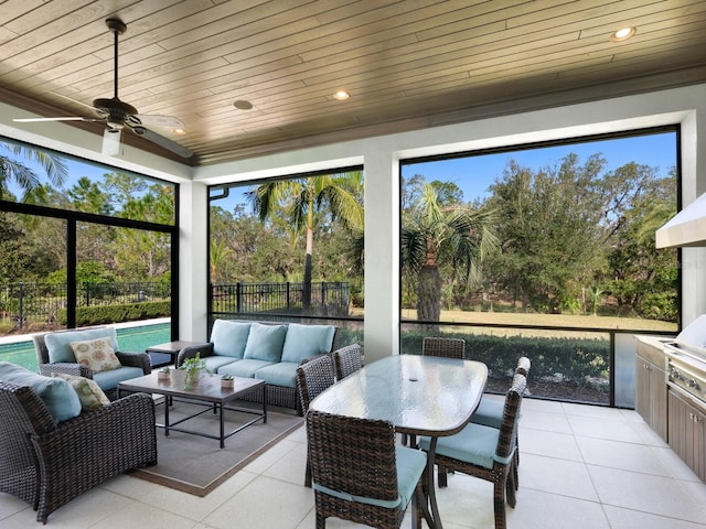 sunroom / solarium with ceiling fan and wooden ceiling