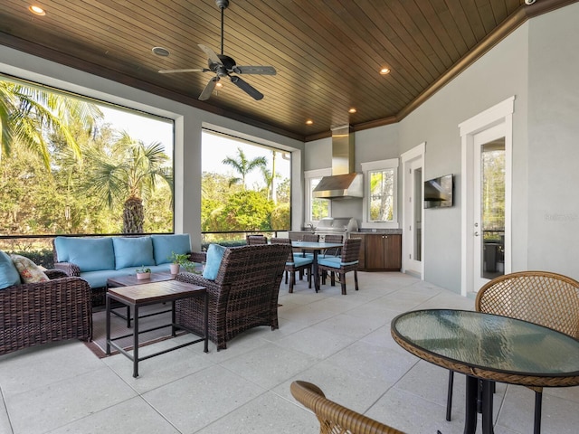 exterior space with ceiling fan and wood ceiling