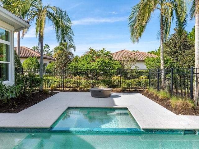 view of swimming pool with an in ground hot tub and a patio area