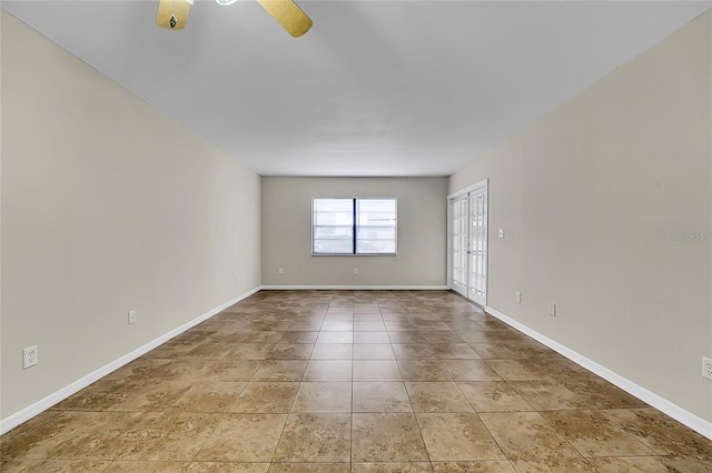 unfurnished room featuring french doors and ceiling fan