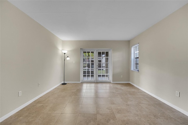 spare room featuring light tile patterned floors