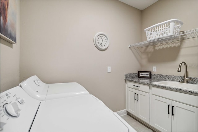 laundry room with separate washer and dryer, sink, light tile patterned flooring, and cabinets