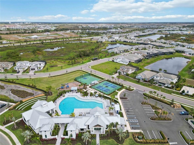 birds eye view of property with a water view