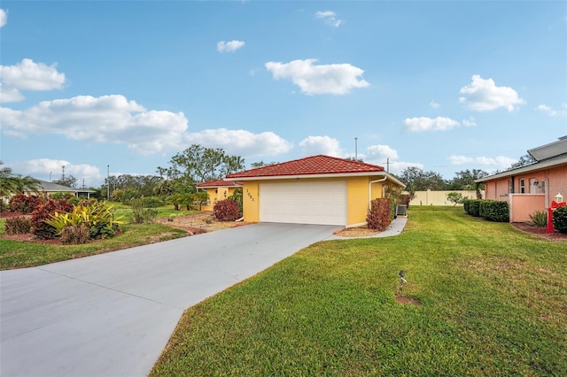 view of front facade with a garage and a front lawn