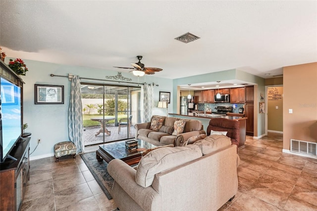 living room featuring ceiling fan