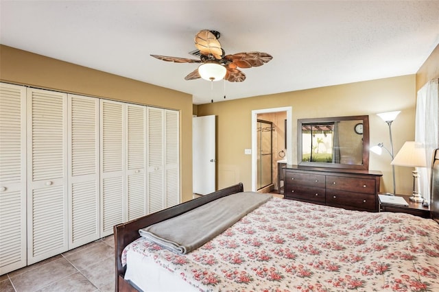 tiled bedroom with a closet and ceiling fan