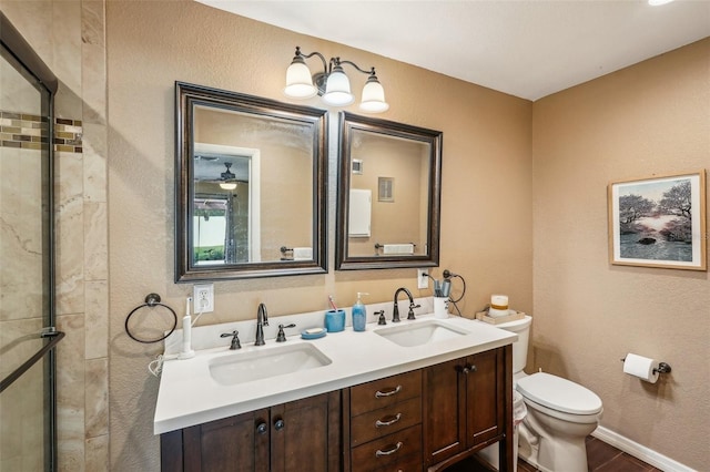 bathroom featuring wood-type flooring, vanity, and toilet