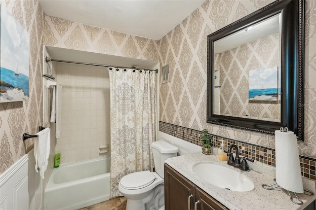 full bathroom featuring shower / bath combo, vanity, tasteful backsplash, and toilet