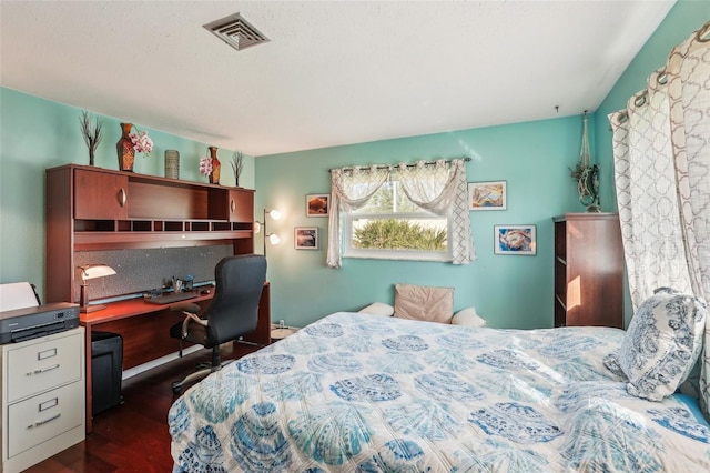 bedroom featuring dark hardwood / wood-style floors