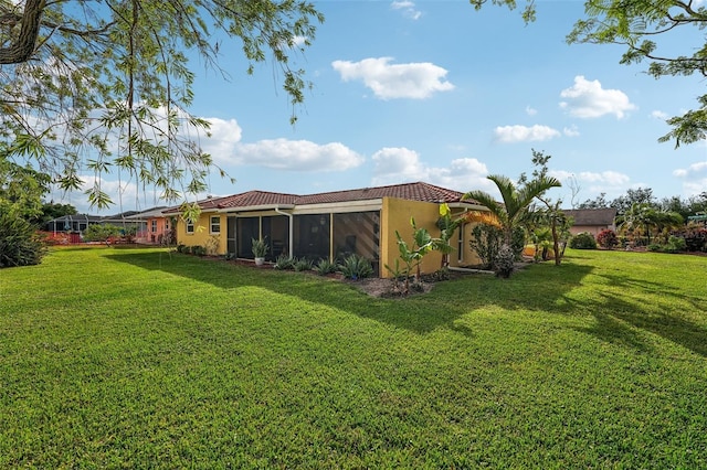 view of yard featuring a sunroom