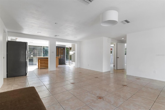 empty room with light tile patterned floors