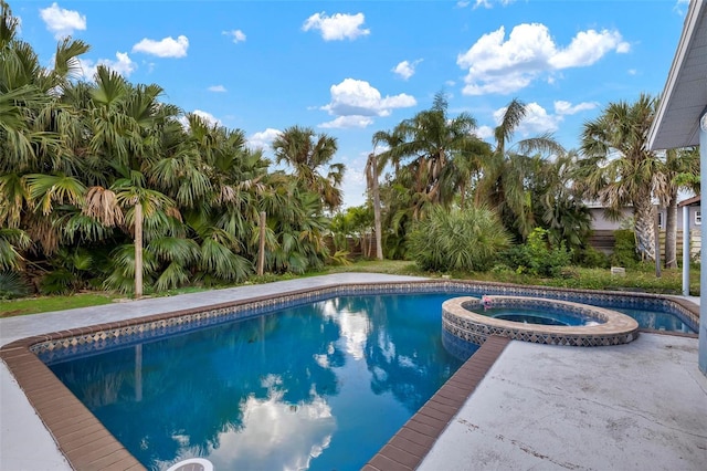 view of pool with an in ground hot tub