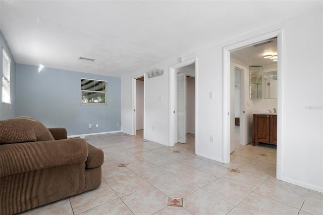 living room with light tile patterned flooring