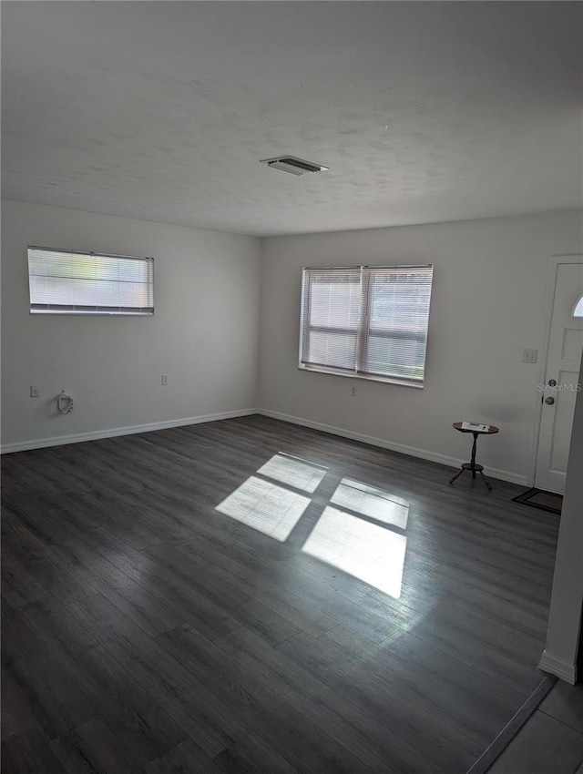 empty room featuring dark hardwood / wood-style floors