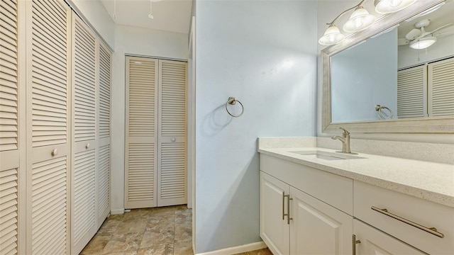 bathroom featuring ceiling fan and vanity