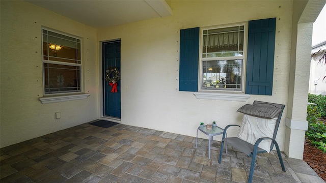 doorway to property with a porch