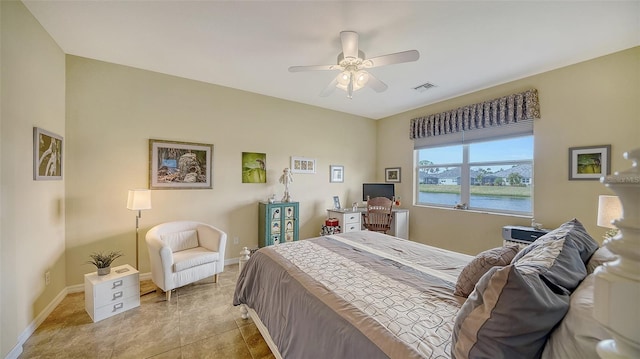 bedroom featuring ceiling fan and light tile patterned floors