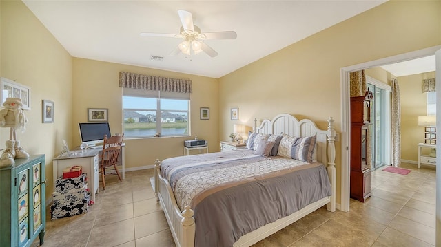 bedroom with ceiling fan and light tile patterned floors