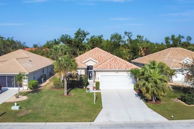 view of front of home with cooling unit, a garage, and a front lawn