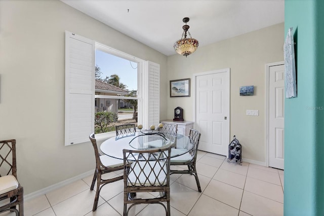 dining area featuring light tile patterned flooring