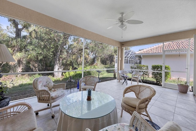 sunroom featuring ceiling fan