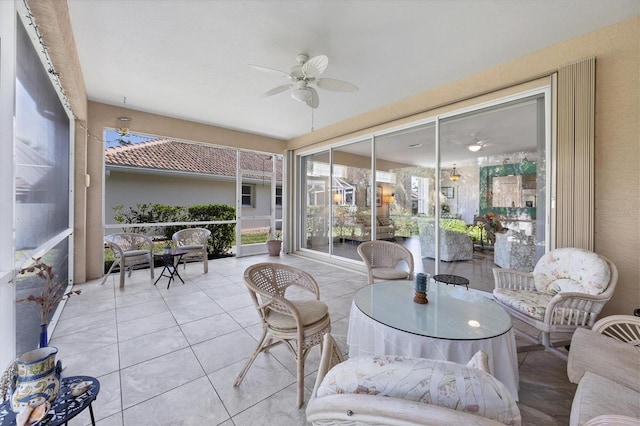 sunroom / solarium with ceiling fan