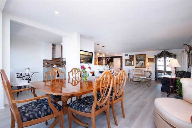 dining room with light hardwood / wood-style flooring