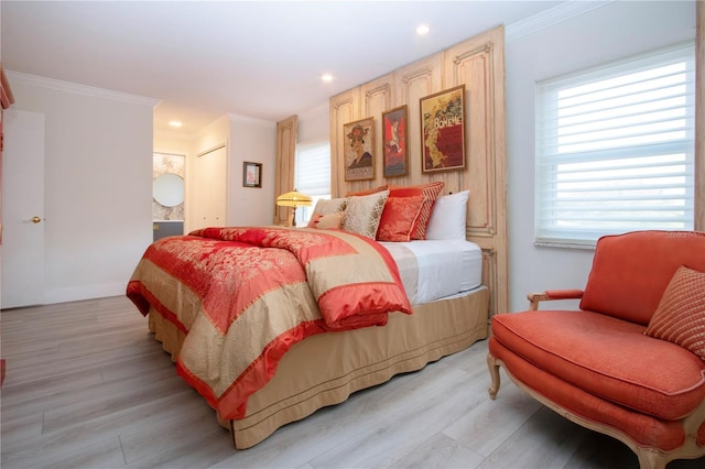 bedroom featuring light hardwood / wood-style floors and ornamental molding