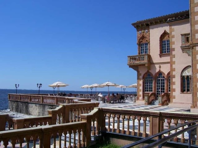 wooden terrace with a water view