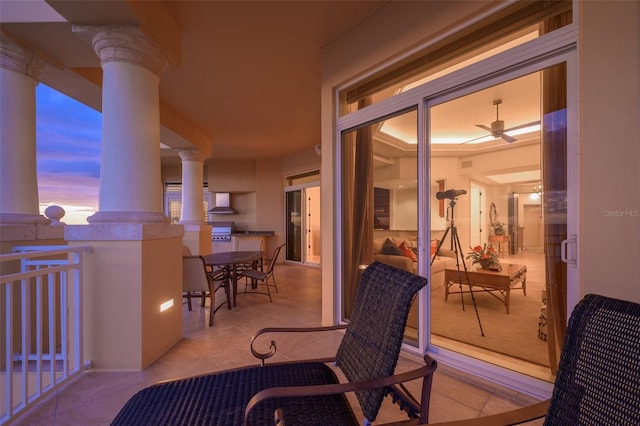 balcony at dusk with ceiling fan