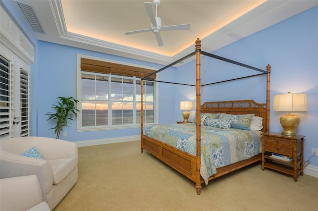 bedroom with ceiling fan, crown molding, and carpet