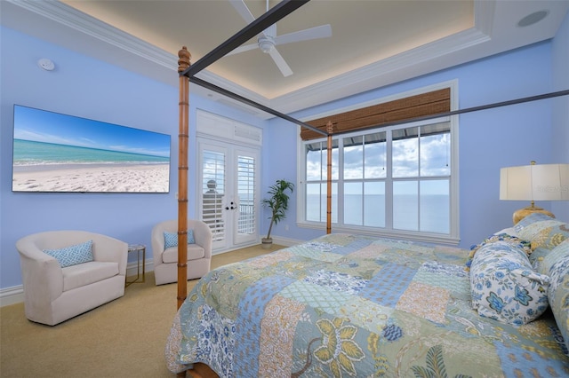 bedroom featuring carpet, access to outside, ceiling fan, crown molding, and a water view