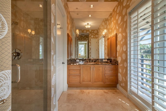 bathroom with vanity and an enclosed shower