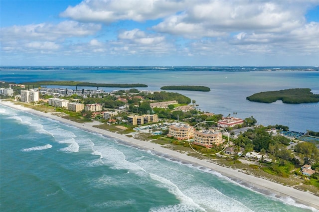 drone / aerial view with a water view and a view of the beach