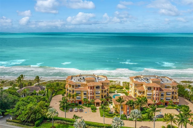 bird's eye view with a water view and a view of the beach