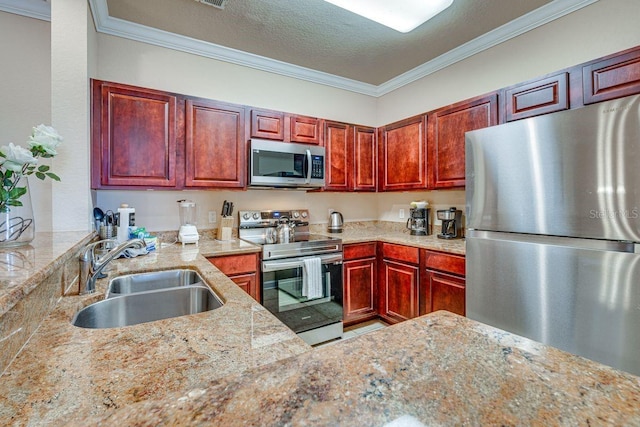 kitchen featuring light stone counters, ornamental molding, sink, and appliances with stainless steel finishes