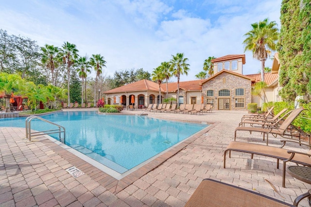 view of swimming pool with a patio