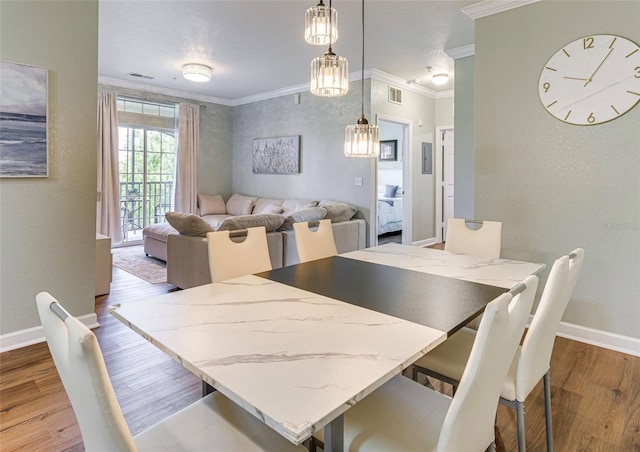 1301 Tuscan Ter Unit 9401, Davenport, FL 33896 - dining room featuring wood finished floors, crown molding, and a textured wall