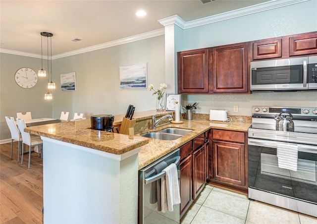 1301 Tuscan Ter Unit 9401, Davenport, FL 33896 - kitchen featuring appliances with stainless steel finishes, a peninsula, crown molding, light stone counters, and hanging light fixtures