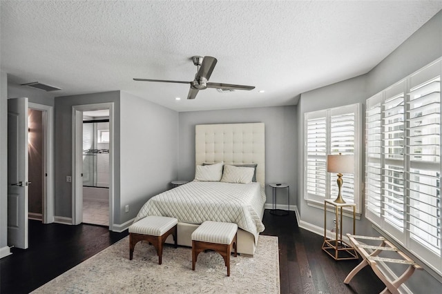 bedroom featuring a textured ceiling, connected bathroom, dark hardwood / wood-style floors, and ceiling fan