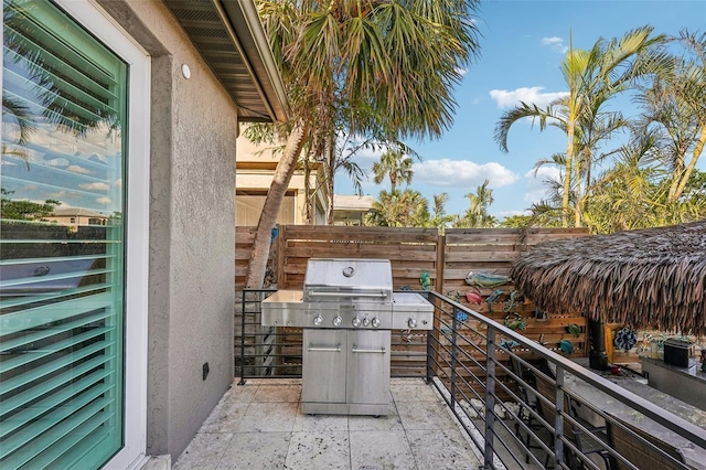 view of patio featuring a grill