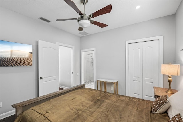 bedroom with ceiling fan, ensuite bathroom, and a closet