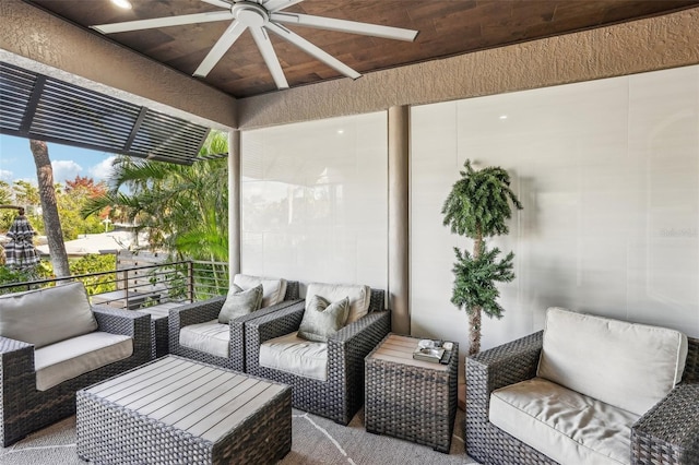 view of patio featuring a balcony and ceiling fan