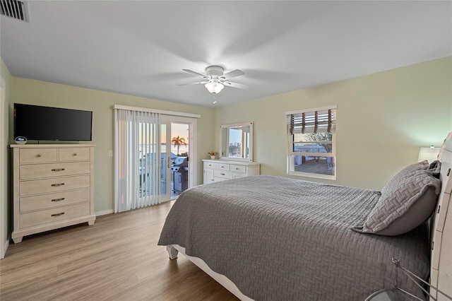 bedroom with ceiling fan, light hardwood / wood-style floors, and access to exterior