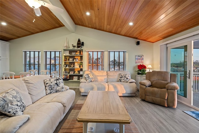 living room featuring lofted ceiling with beams, plenty of natural light, ceiling fan, and wood ceiling