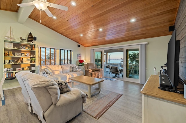 living room with ceiling fan, a healthy amount of sunlight, wooden ceiling, vaulted ceiling with beams, and light hardwood / wood-style flooring