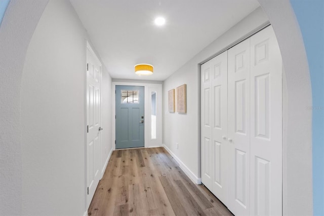 doorway to outside with light wood-type flooring